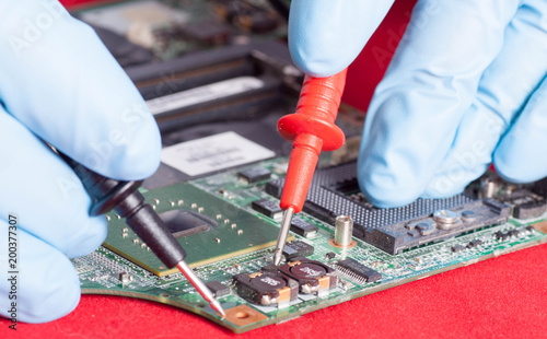 Printed circuit board testing in repair service close-up