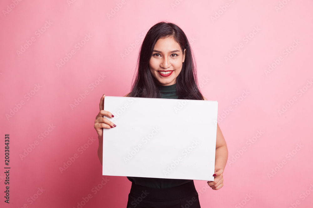 Young Asian woman with white blank sign. Young Asian woman with white blank sign.
