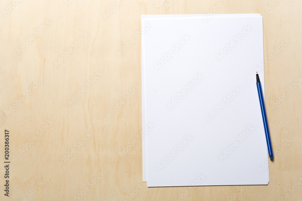 White business card on wooden table. Blank portrait A4.
