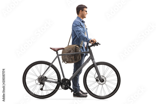 Young man with a bicycle waiting in line