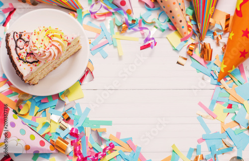 birthday cake and decoration on white wooden background