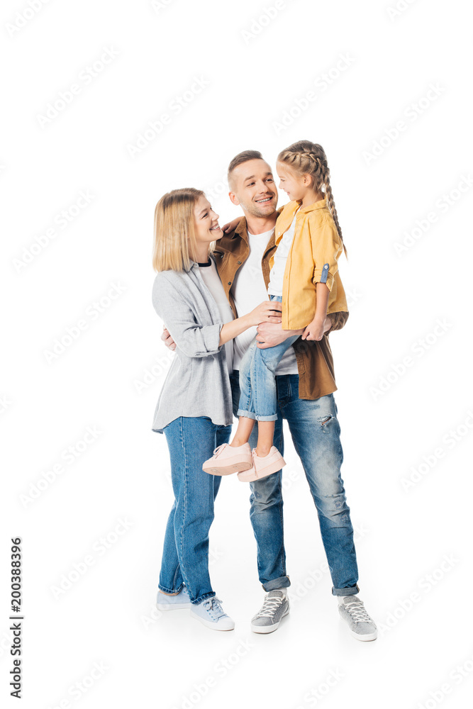 smiling man holding cute daughter with wife standing near by isolated on white smiling man holding cute daughter with wife standing near by isolated on white