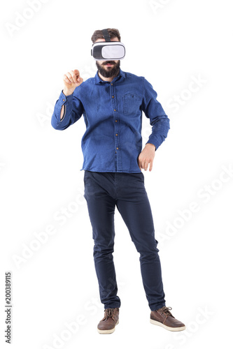 Front view of business man wearing vr glasses pointing finger at interactive touch screen. Full body isolated on white background. 