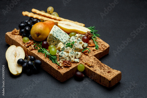pears and cheese on wooden cutting board