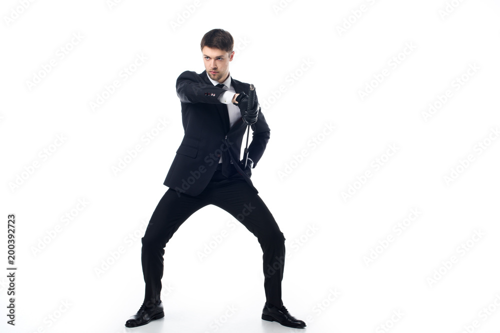 confident agent in suit and gloves with katana isolated on white confident agent in suit and gloves with katana isolated on white