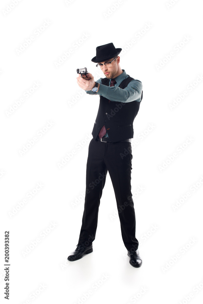 stylish spy agent in hat and eyeglasses with gun isolated on white stylish spy agent in hat and eyeglasses with gun isolated on white