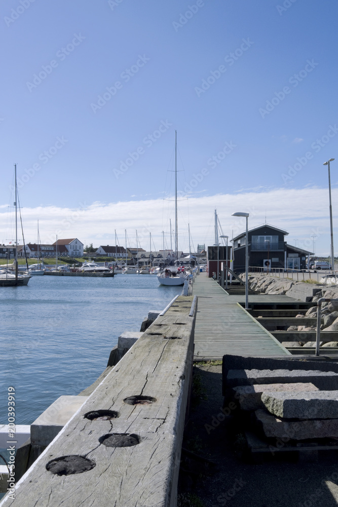 Laesoe / Denmark: View over the mole to the cozy marina in Vesteroe Havn