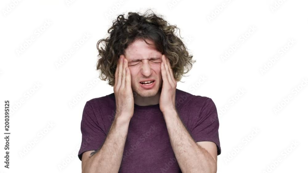 Portrait of sick unhappy man rubbing temples, and touching forehead because of headache or temperature over white background. Concept of emotions Portrait of sick unhappy man rubbing temples, and touching forehead because of headache or temperature over white background. Concept of emotions