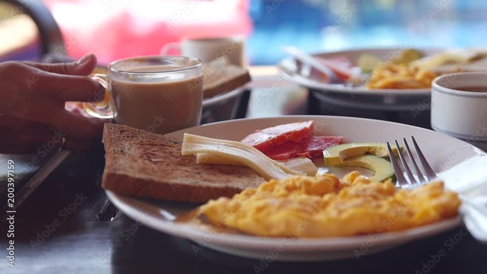 Take tasty invigorating coffee from the table with a delicious breakfast. Slow motion. HD, 1920x1080 Take tasty invigorating coffee from the table with a delicious breakfast. Slow motion. HD, 1920x1080