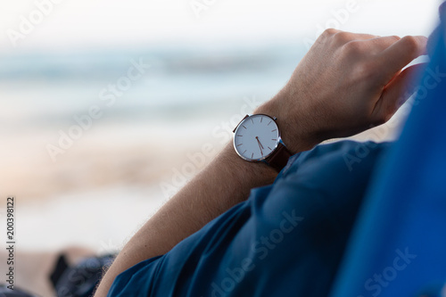 A man sitting at the beach and thinking