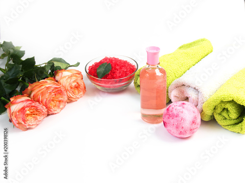 Sea salt, towels,dry bath bomb, tea candles, aroma oil in bottles and lavender on background.Flat lay. Spa cosmetic products.Spa treatments. Spa and wellness setting with flowers and towels. Dayspa photo