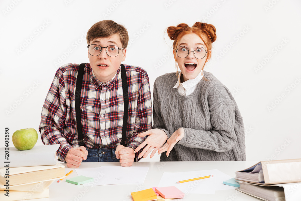 Funny couple of school nerds celebrating Funny couple of school nerds celebrating