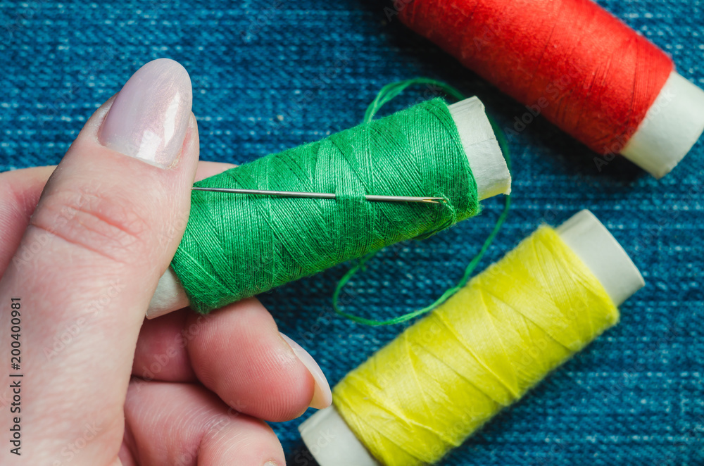 Spool of Green Thread with Needle Stock Photo - Image of yarn