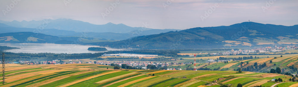 Beautiful sunset view on Orava villages and Orava dam with Rohace hills on the background from Klin, Slovakia