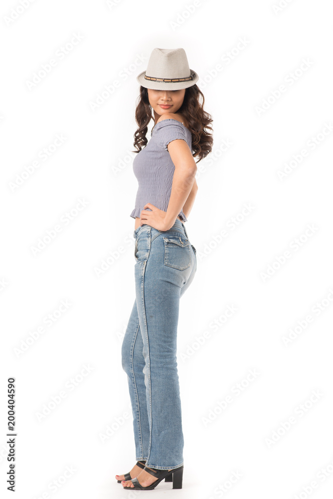Portrait of beautiful Asian girl wearing jeans and hat on white background Portrait of beautiful Asian girl wearing jeans and hat on white background