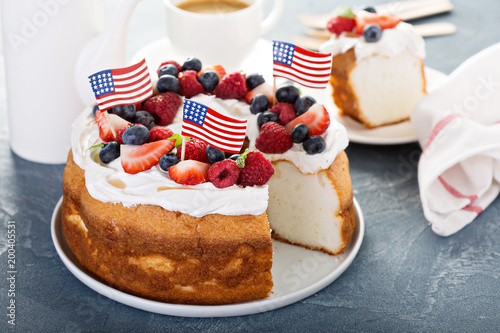 Angel food cake with cream and berries photo