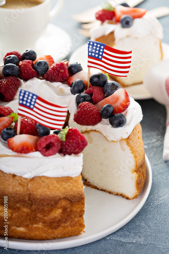 Angel food cake with cream and berries photo