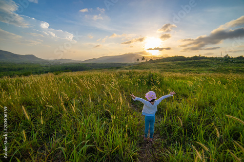 Girl with beautiful grass field