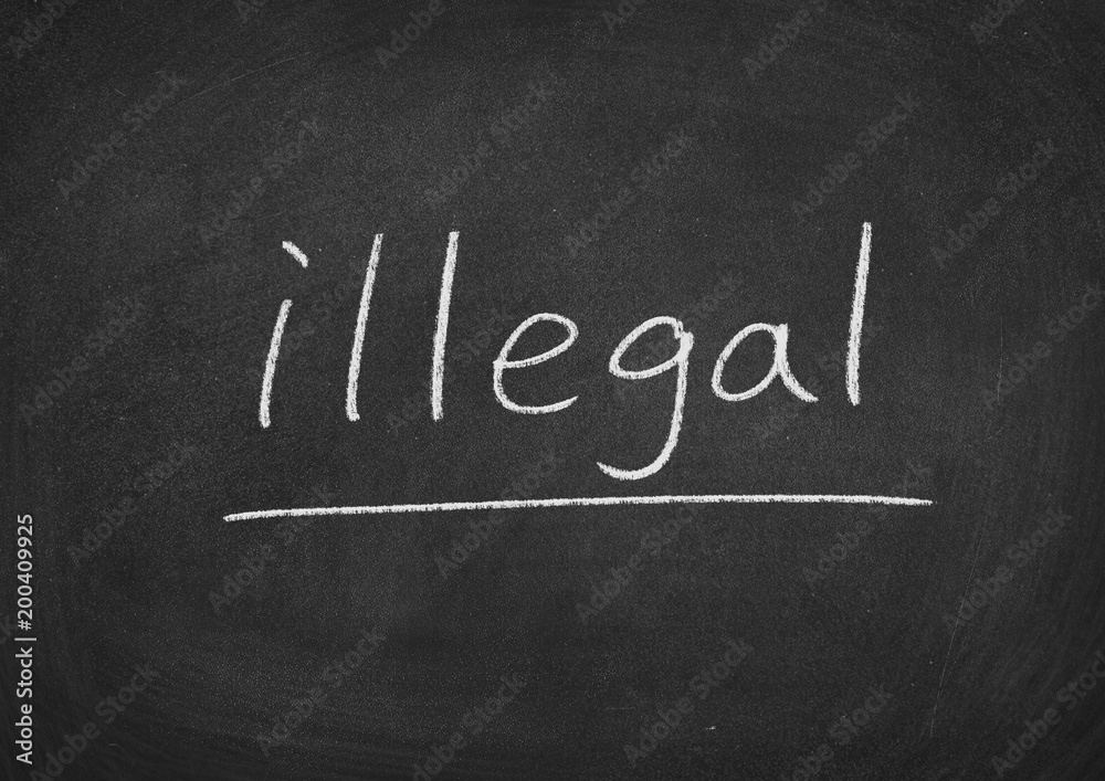 Obraz premium illegal concept word on a blackboard background