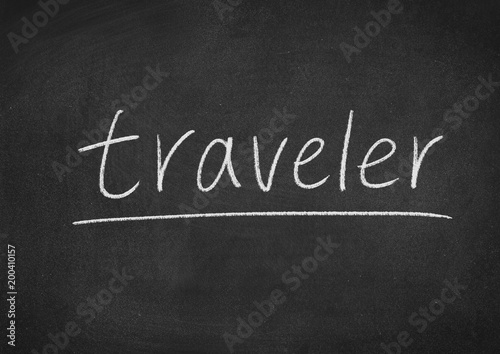 traveler concept word on a blackboard background