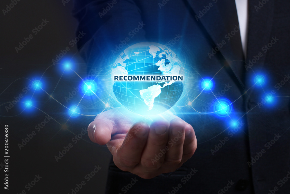 Business, Technology, Internet and network concept. Young businessman working on a virtual screen of the future and sees the inscription: Recommendation Business, Technology, Internet and network concept. Young businessman working on a virtual screen of the future and sees the inscription: Recommendation