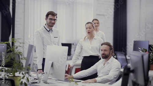 Young businesswoman joking of his colleague in the office photo