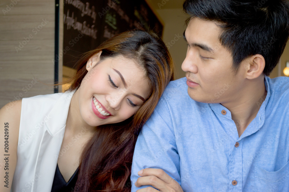 .Lovers are showing affection for each other in a coffee shop. .Lovers are showing affection for each other in a coffee shop.