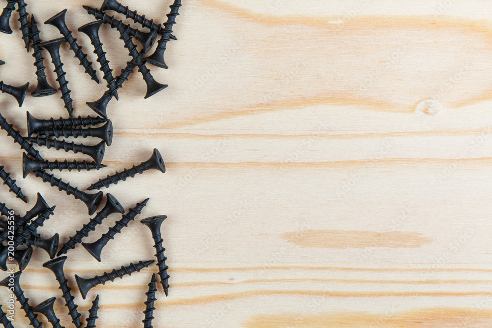 Background. Black hardware on a light wood background Background. Black hardware on a light wood background