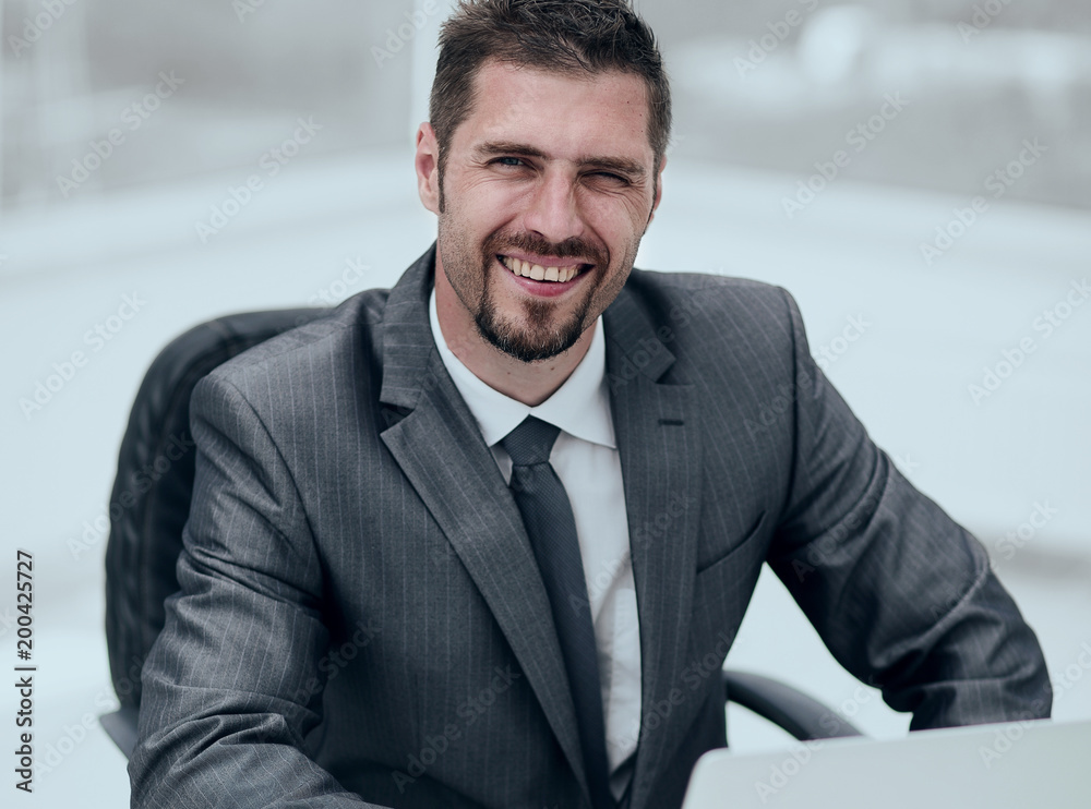 closeup.smiling businessman working with laptop closeup.smiling businessman working with laptop