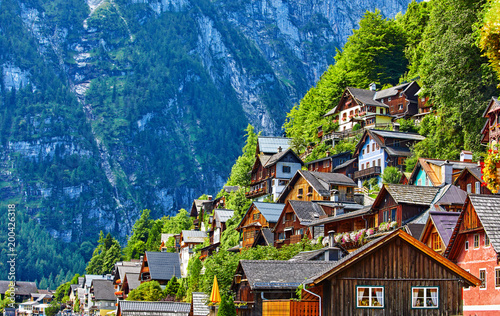 Hallstatt, Austria. Vintage wooden houses on slopes knolls banks