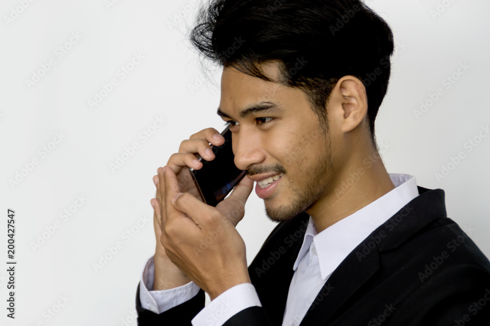 Happy smart businessman talking on mobile phone Happy smart businessman talking on mobile phone