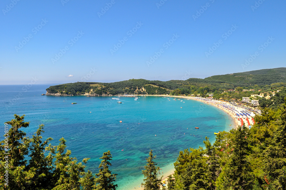 Parga, Epirus - Greece. Panoramic view of Valtos Beach one of the longest organized  beaches of Parga. It is located near the castle of Parga. 