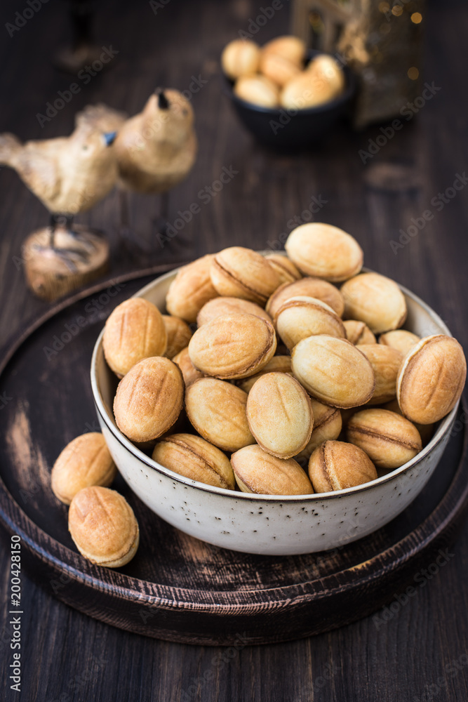 Traditional Russian dessert - nuts from short pastry with boiled condensed milk, caramel cream Traditional Russian dessert - nuts from short pastry with boiled condensed milk, caramel cream