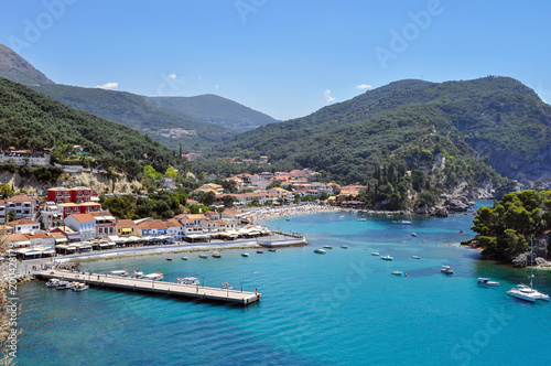 Panoramic view of Parga town in Greece on a sunny day with blue sky. Port  jetty   Krioneri beach  island of Panagia