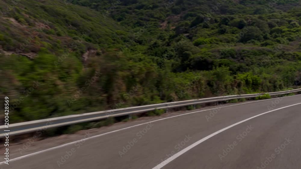 POV hyperlapse shot from a camera attached to the front of a vehicle driving along mountain roads in spain POV hyperlapse shot from a camera attached to the front of a vehicle driving along mountain roads in spain