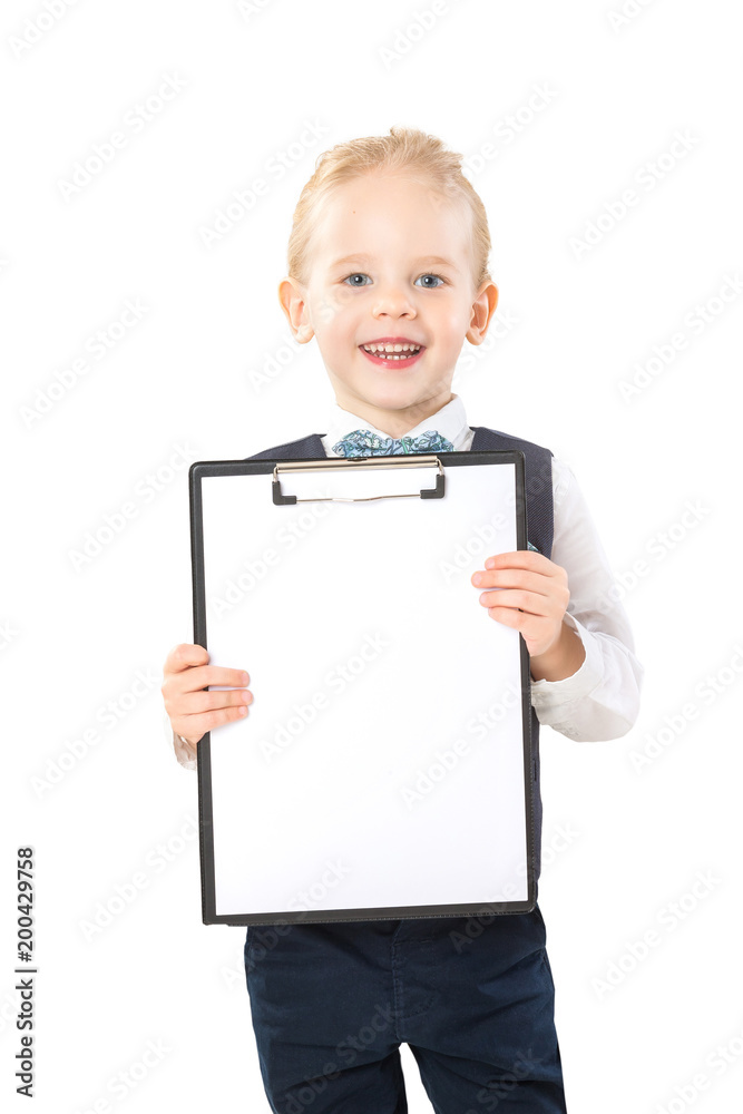 Happy smiling boy in suit is holding folder with blank paper list isolated at white background. Happy smiling boy in suit is holding folder with blank paper list isolated at white background.