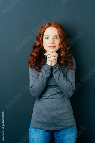Eager excited young redhead woman