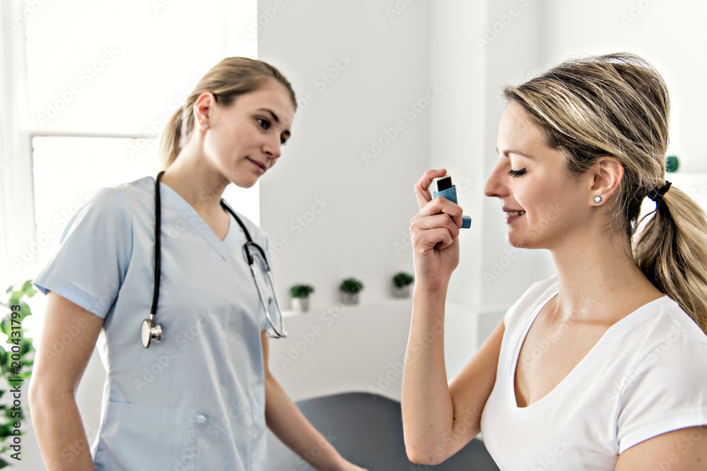 Asthma Woman with doctor at the hospital