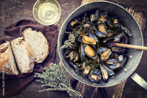 Photography Traditional barbecue Italian blue mussel with farmhouse bread and white wine as