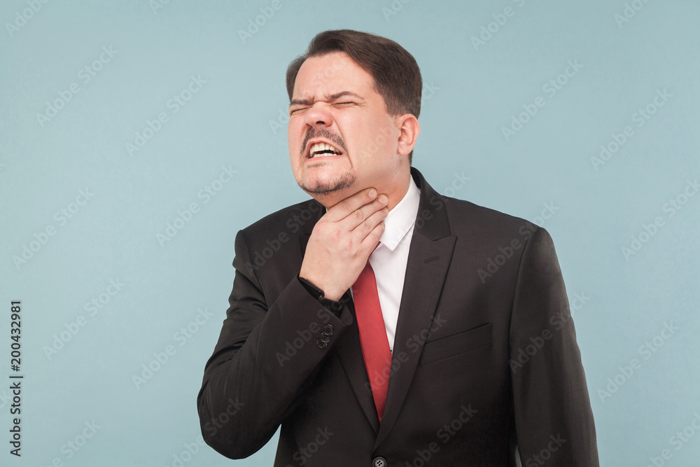 Bad feelings concept. Businessman have neck pain Bad feelings concept. Businessman have neck pain