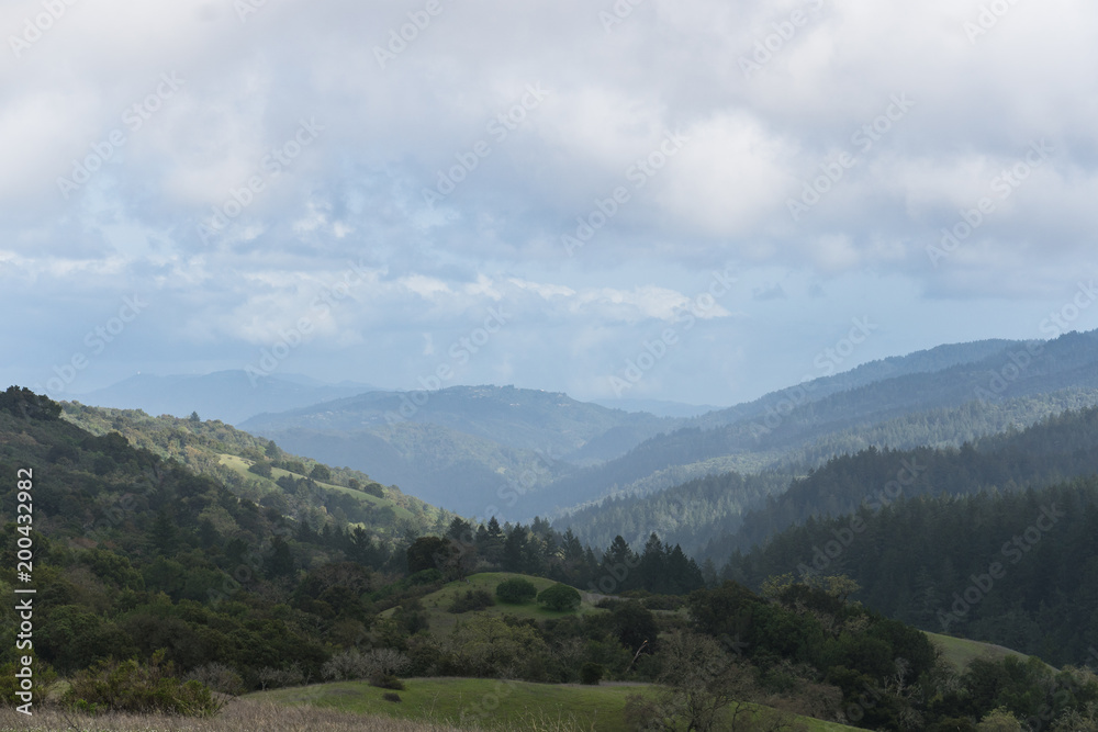 Afternoon sunlight hits the hazy hills of Monte Bello near Palo Alto after a morning rain storm Afternoon sunlight hits the hazy hills of Monte Bello near Palo Alto after a morning rain storm