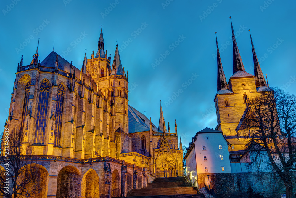 The famous Cathedral and Severi church in Erfurt illuminated after sunset