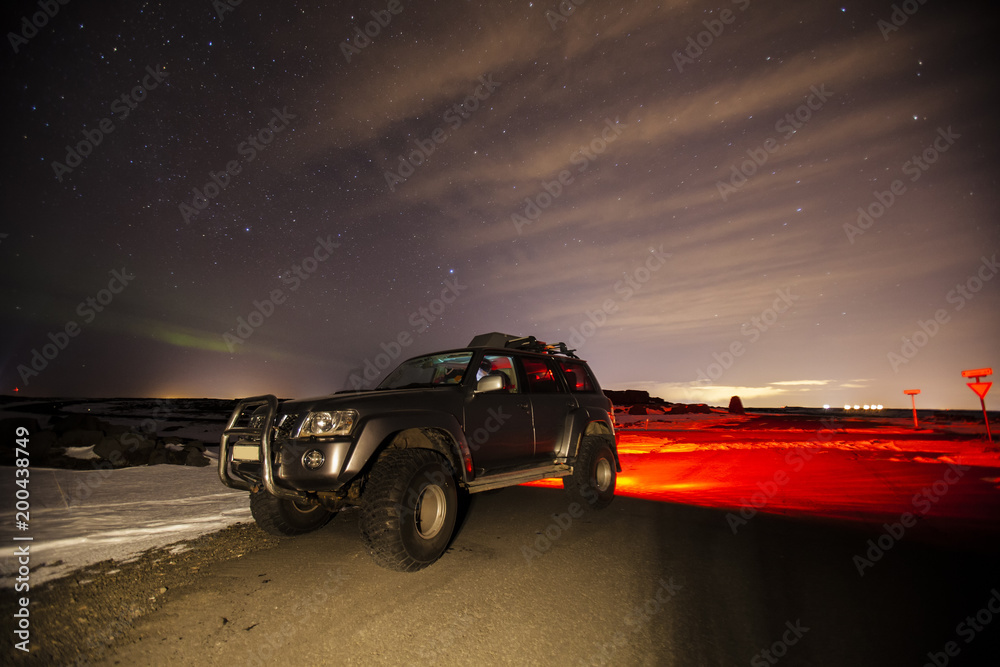 A jeep at night in Iceland