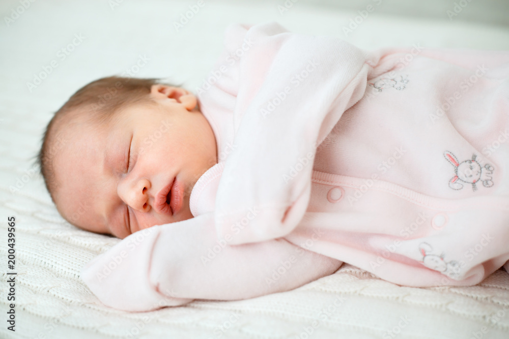Portrait of newborn baby girl sleeping at home Portrait of newborn baby girl sleeping at home
