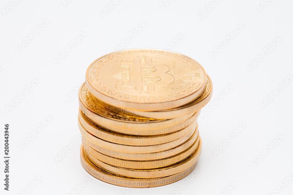 Stack concept of golden bitcoin on white background Stack concept of golden bitcoin on white background