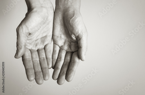 Keeping hands, empty cupped palms together isolated on studio white background - concept of charity, support, protection and care.