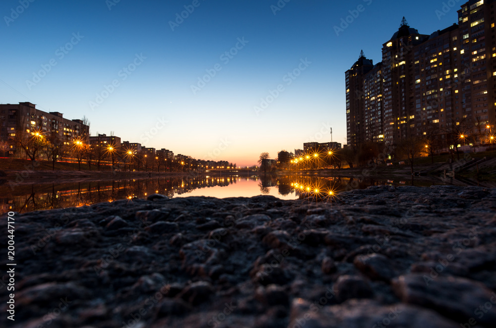 Evening city over the water. River in the city.