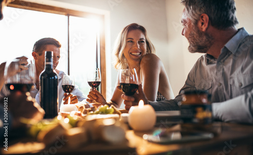 Friends having great time at dinner party