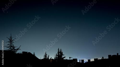 city night silhoutettes with lights and stars