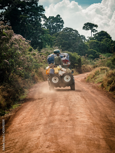 jeep 4wd fully loaded on dirt track in africa central perspective
